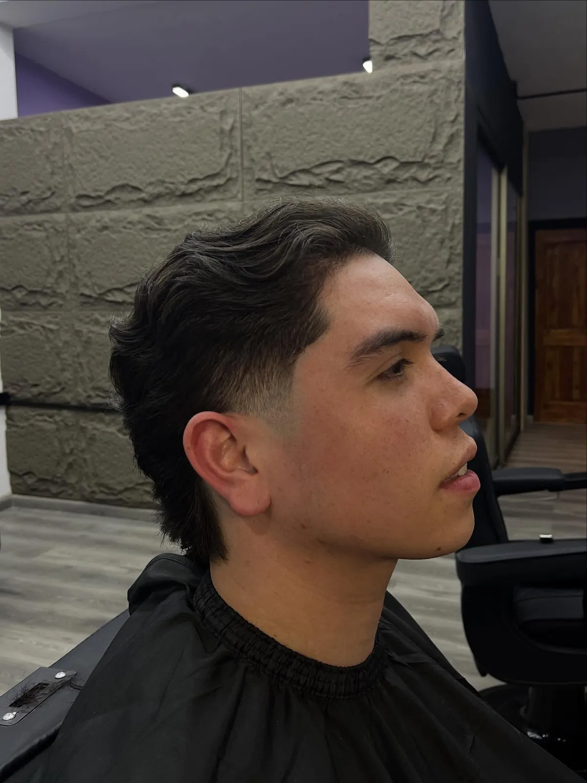 Cliente joven con corte texturizado en Barbería O'Higgins